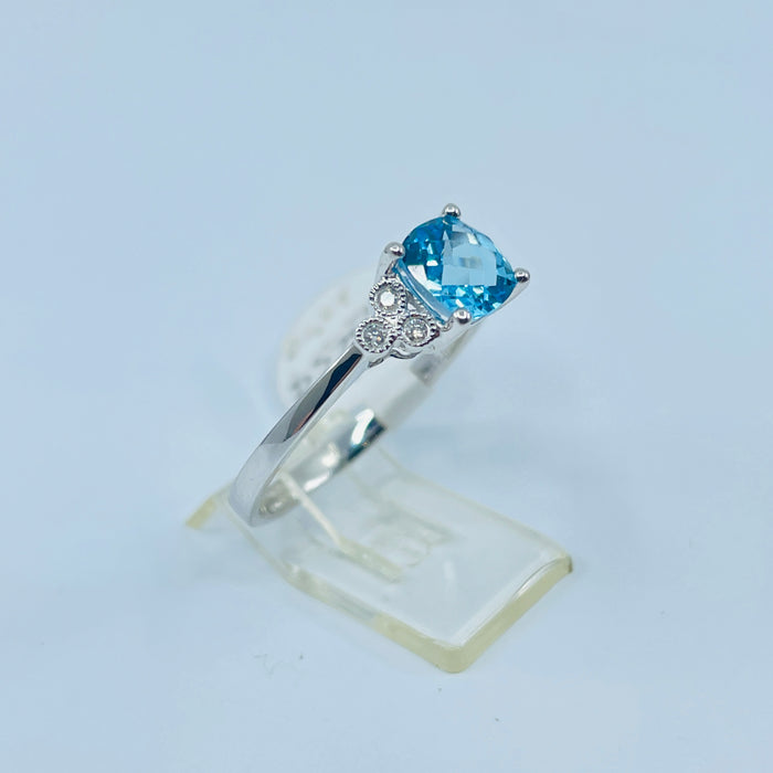 14kt White Gold Blue Topaz and 6 diamond ring