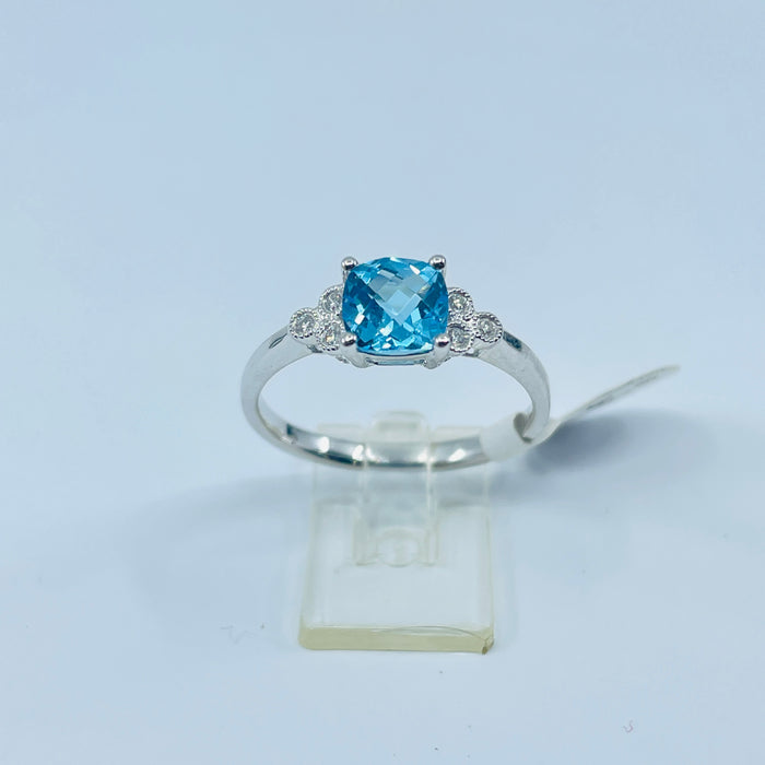 14kt White Gold Blue Topaz and 6 diamond ring